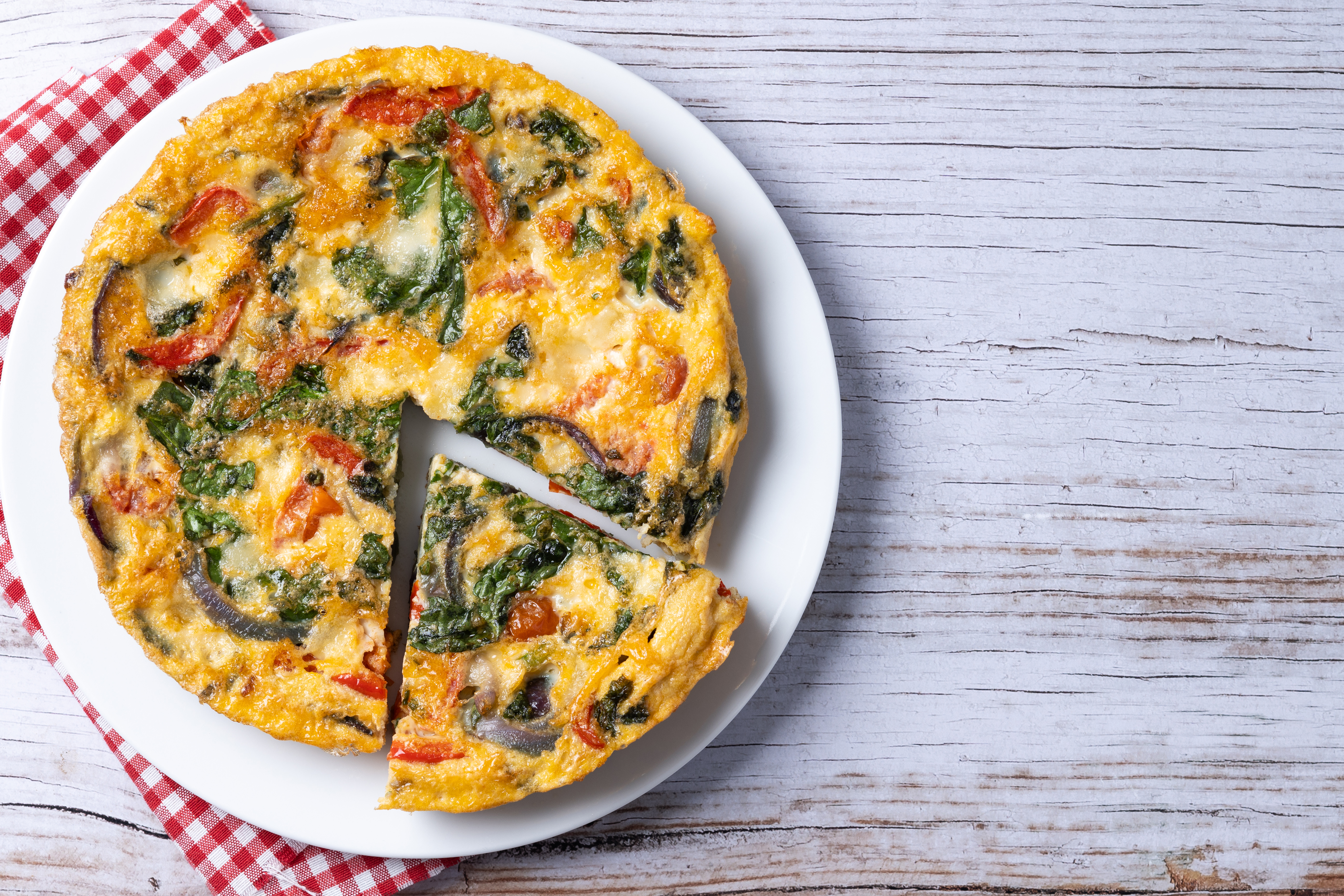Frittata made with tomato, spinach, and egg