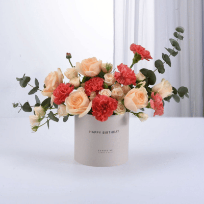 Flower box with red and peach color flowers