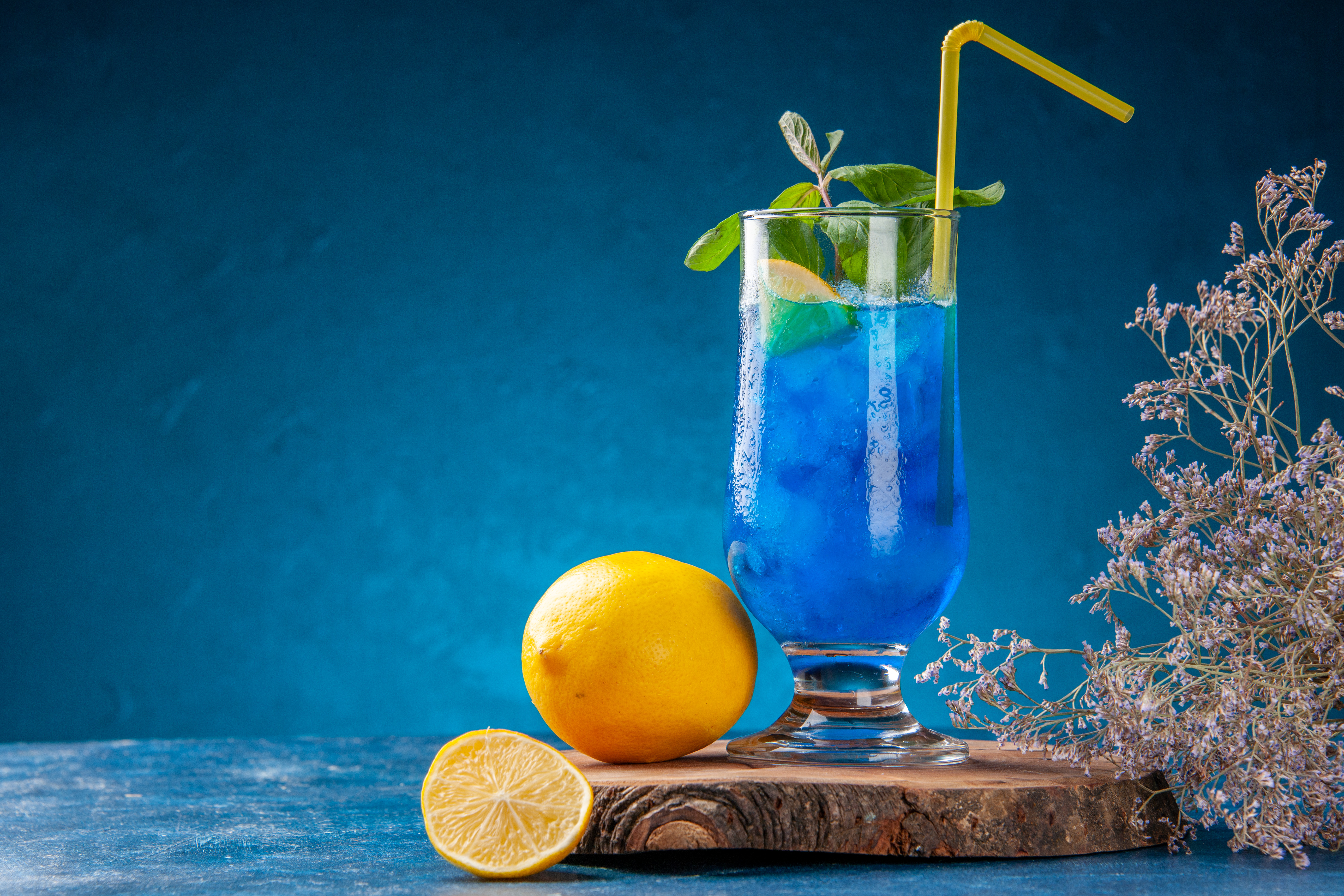 Bright blue tropical cocktail with lemon