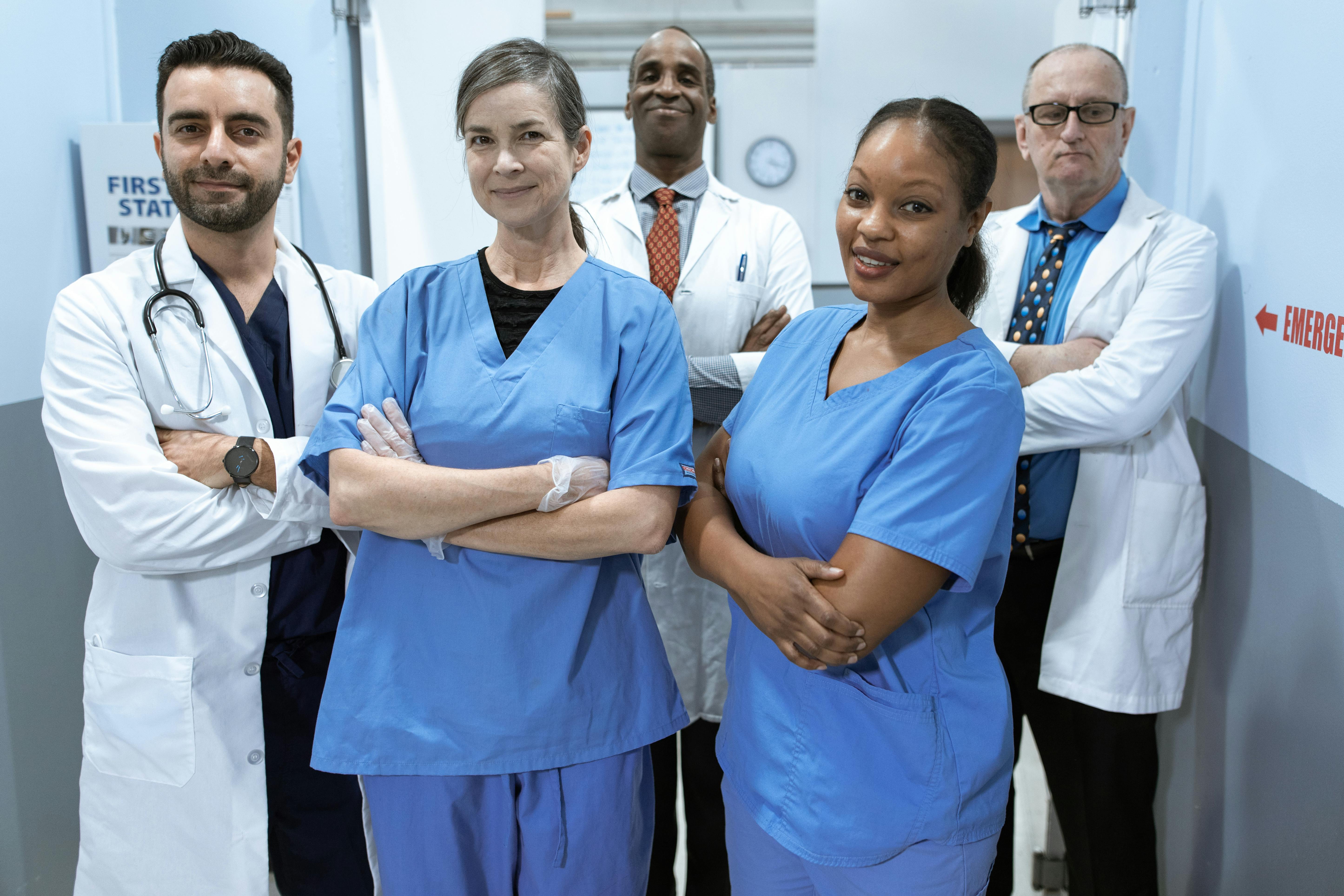 Professional medical team at Royal Wound Care standing confidently in a hospital hallway, representing expert wound care and patient-focused treatment. Professional medical team at Royal Wound Care standing confidently in a hospital hallway, representing expert wound care and patient-focused treatment.
