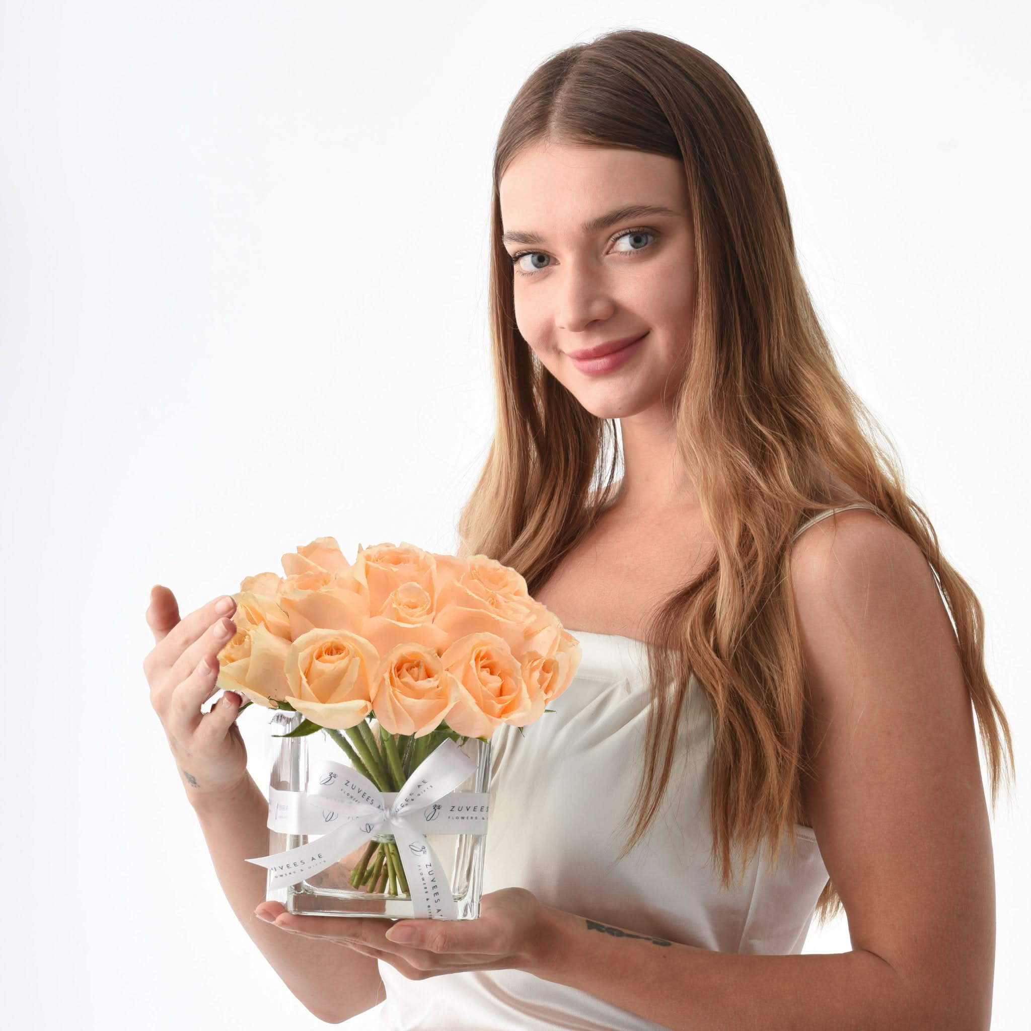 Girl holding a glass flower vase