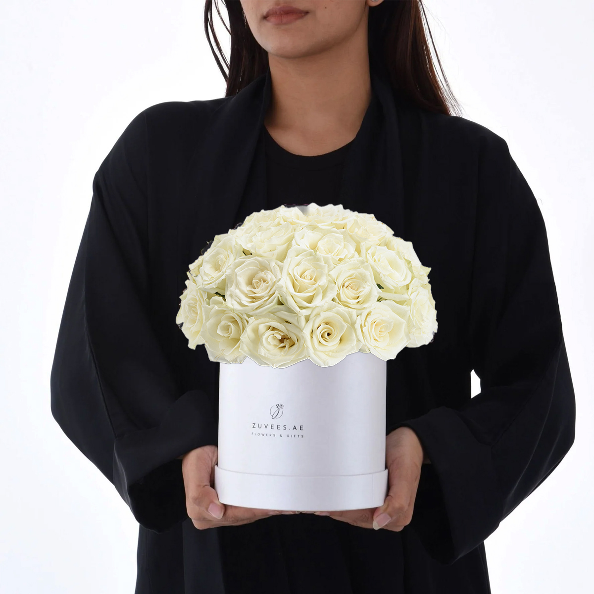 Girl holding white flower box