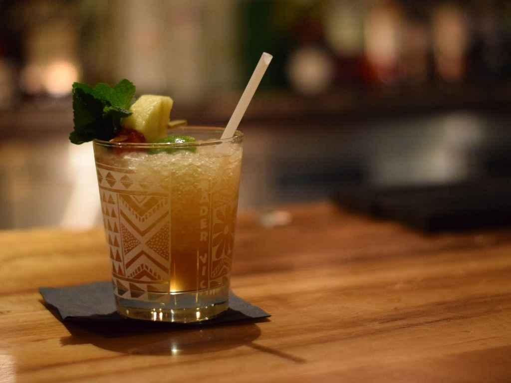 Layered mai tai with citrus garnish