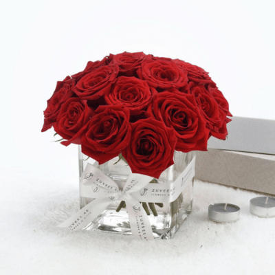 Red roses in glass vase
