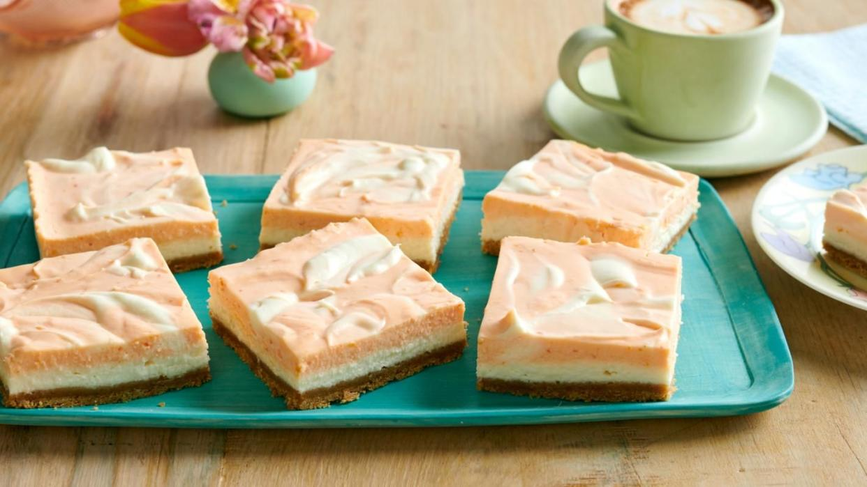 Orange vanilla cheesecake bars with crust