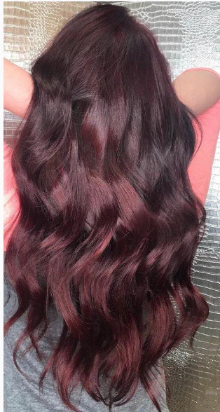 A woman with a beautiful long colored hair.