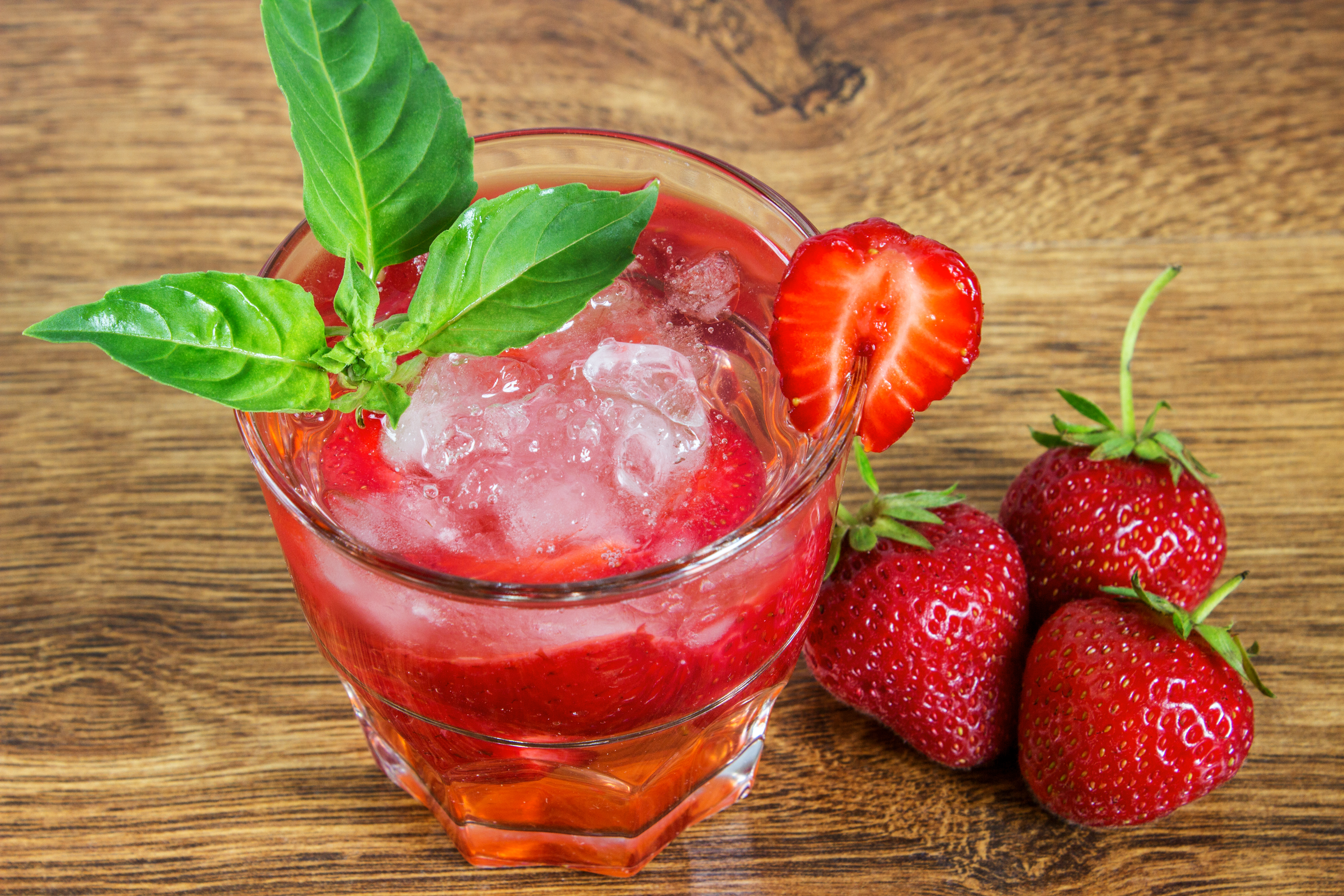Strawberry cocktail with herb and garnish