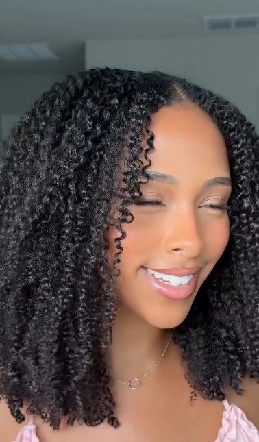 person with curly dark hair