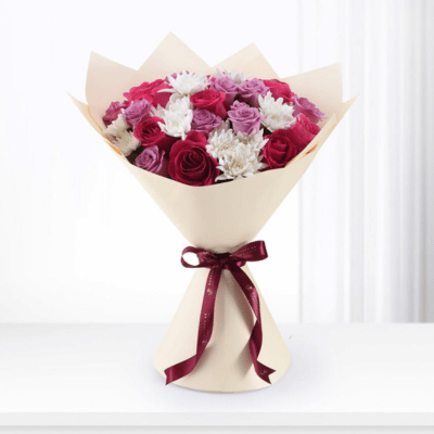 Red, white and purple flowers wrapped in bouquet