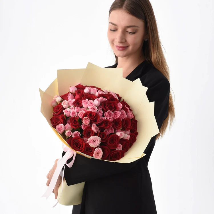 Girl holding 50 roses bouquet
