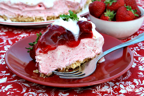 Frozen strawberry pie topped with cream
