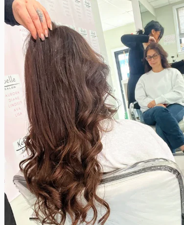 Dark curly hair at salon
