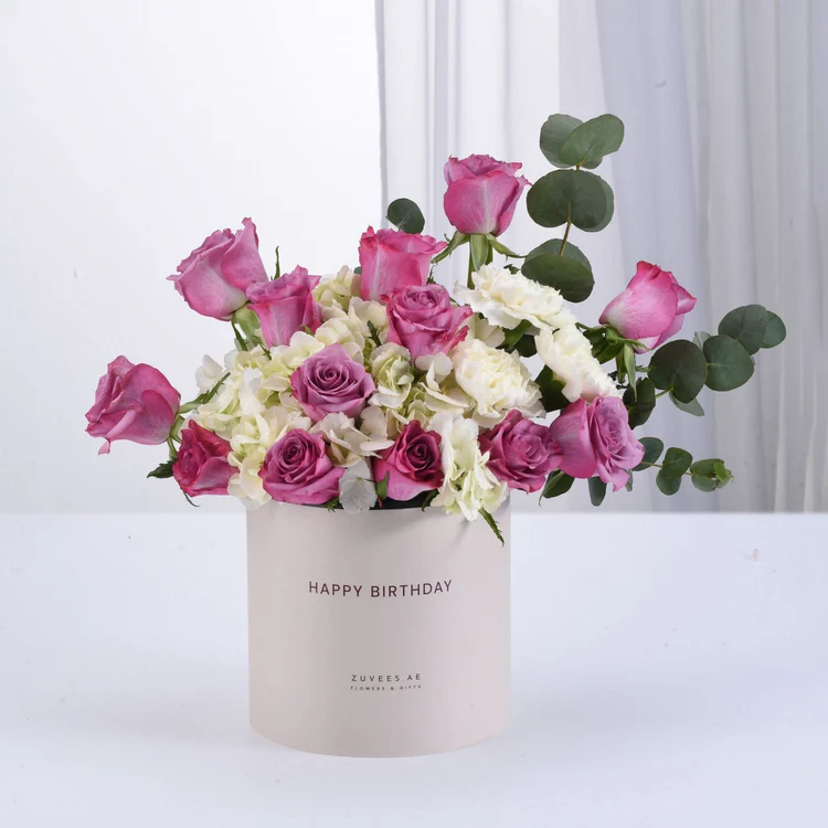 Purple and white flowers in a box