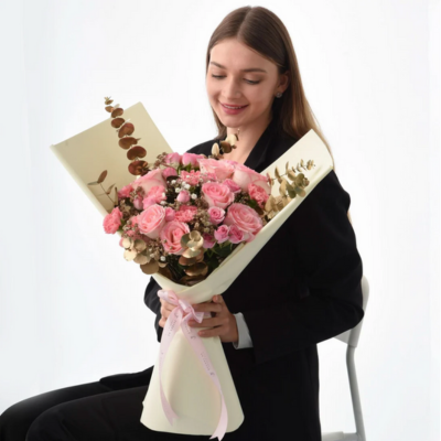 Woman holding a bouquet of flowers