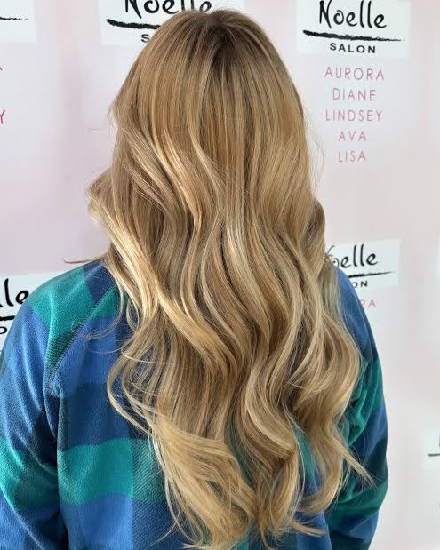 Wavy golden blonde hair styled