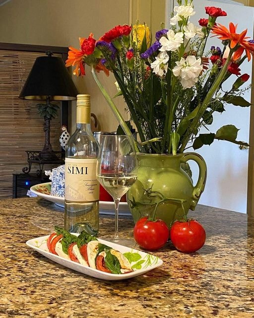 Caprese and bottle of wine 