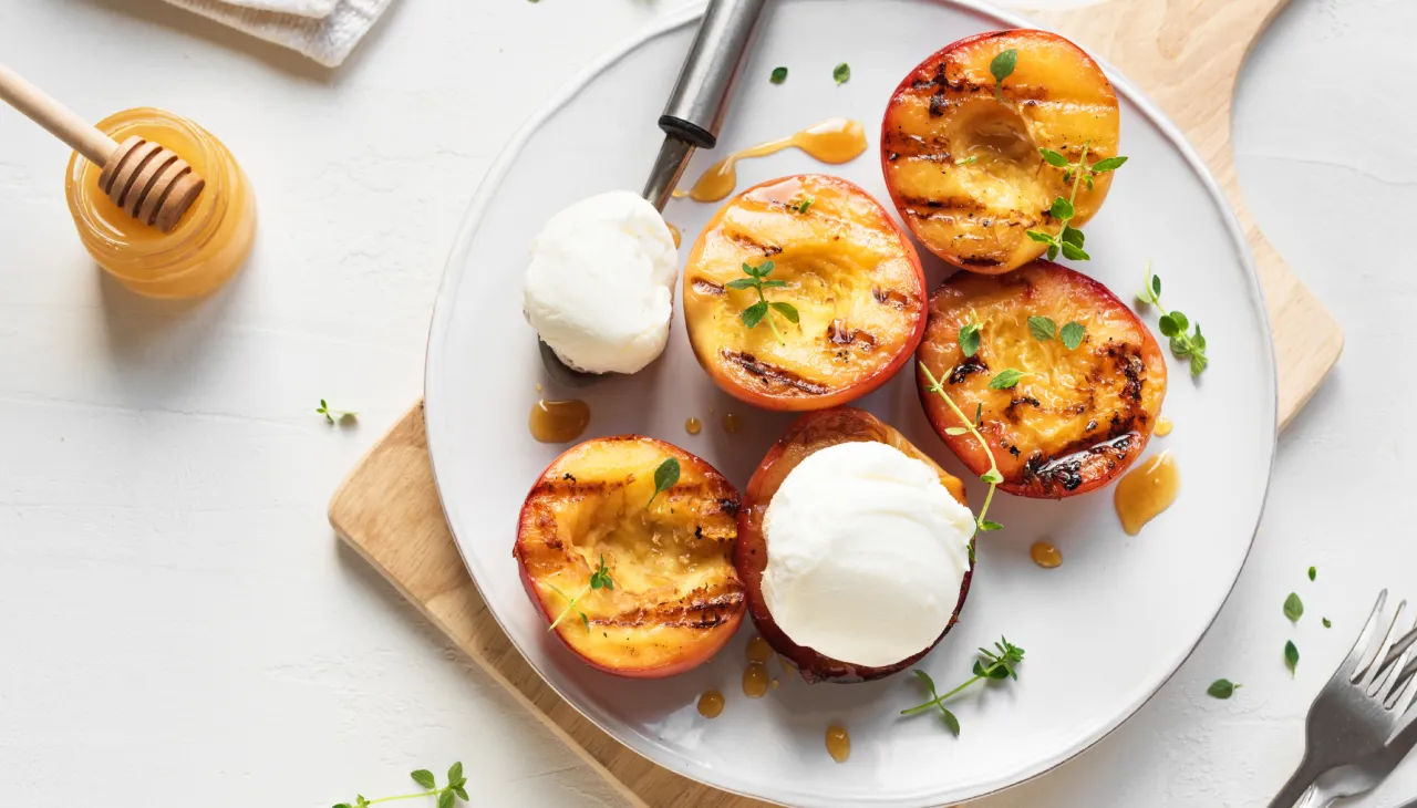 Charred peaches with honey and herbs