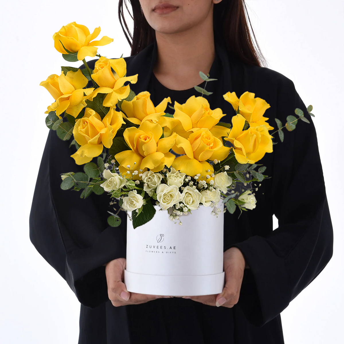 Girl holding yellow flower box