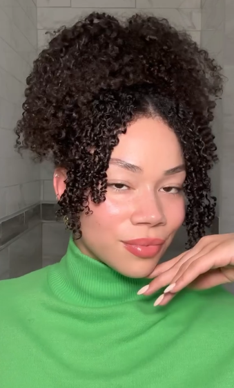 person with curly dark hair